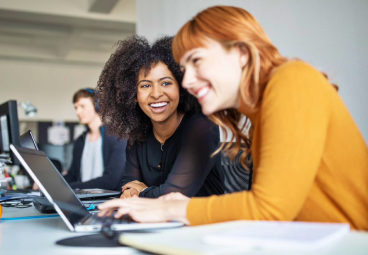 Women looking at enrollment application